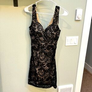 Black lace mini dress with tan inlay. Size M